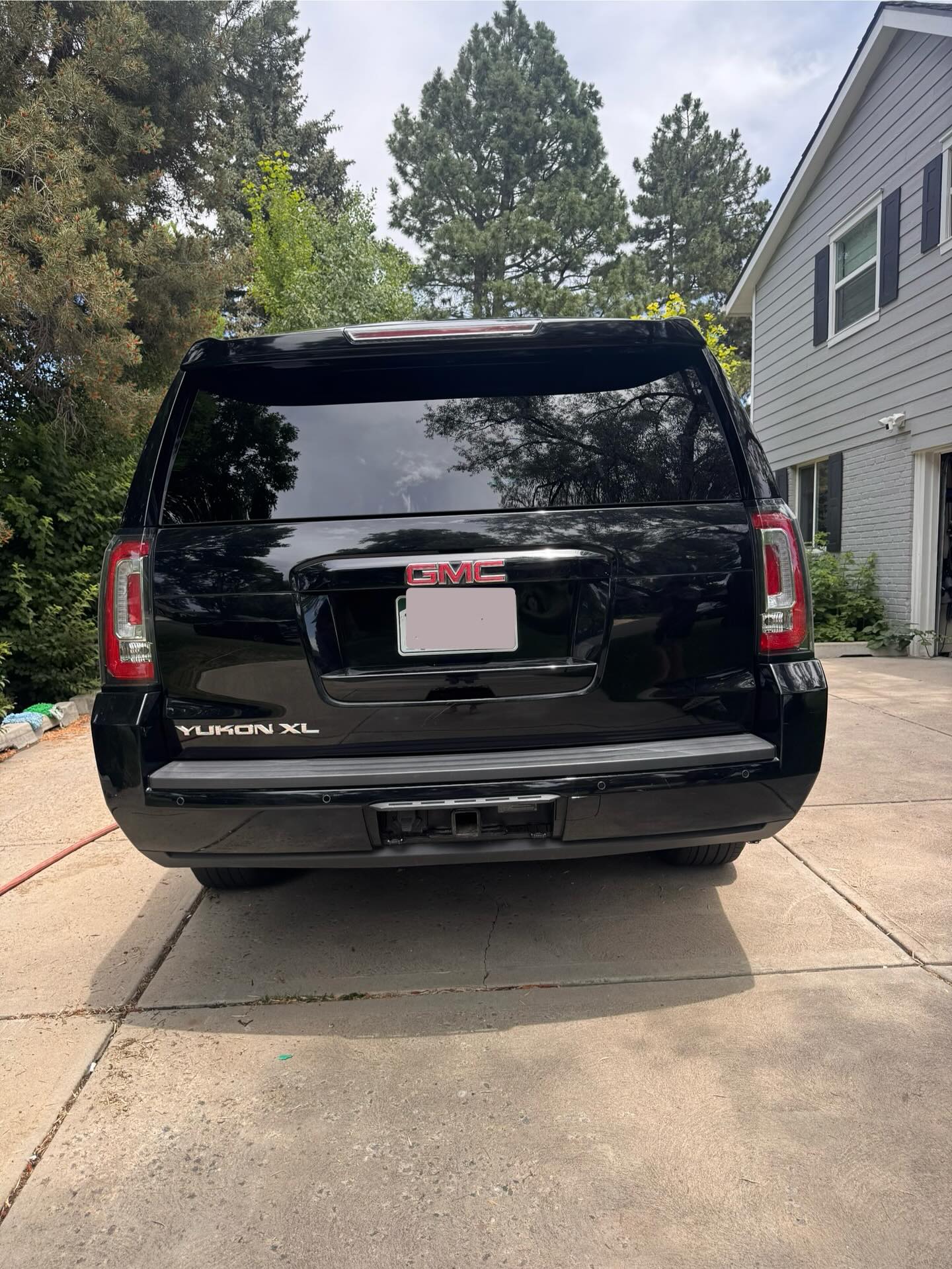 Black Lexus GX, rear view after detailing