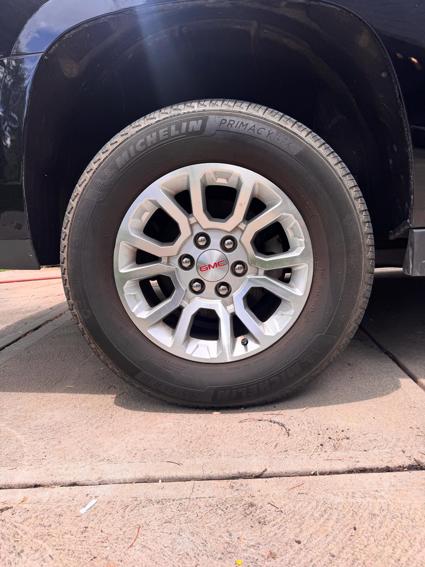 GMC alloy wheel with fresh tire shine