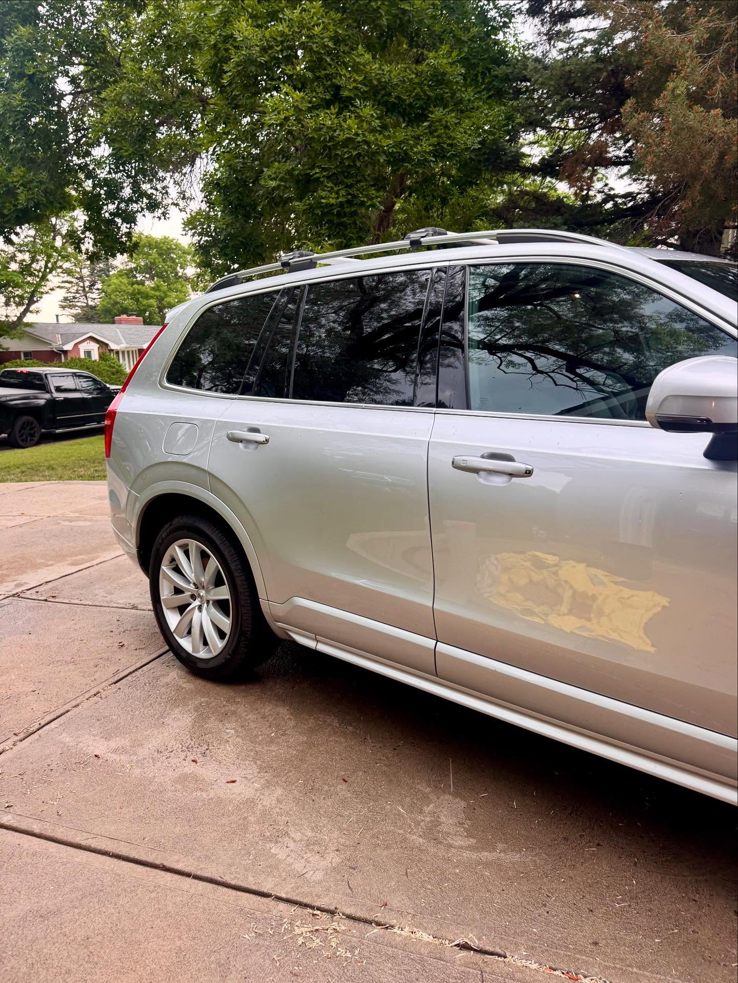 Freshly detailed silver Volvo XC90, rear view
