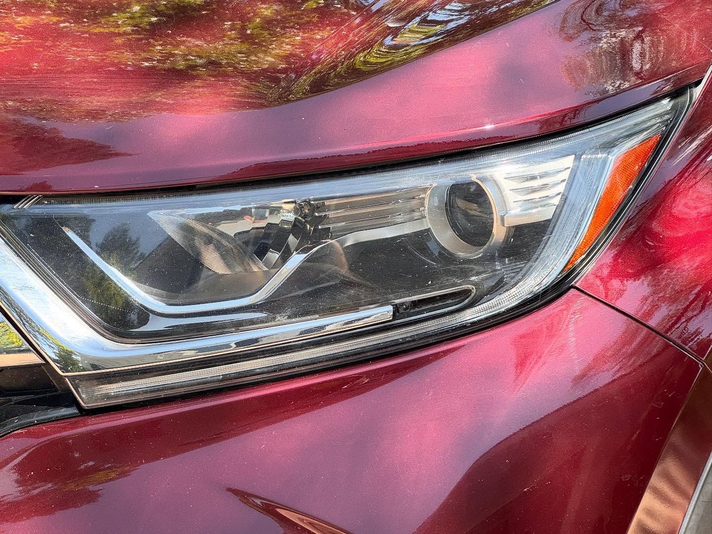 Clear, restored headlight after detailing